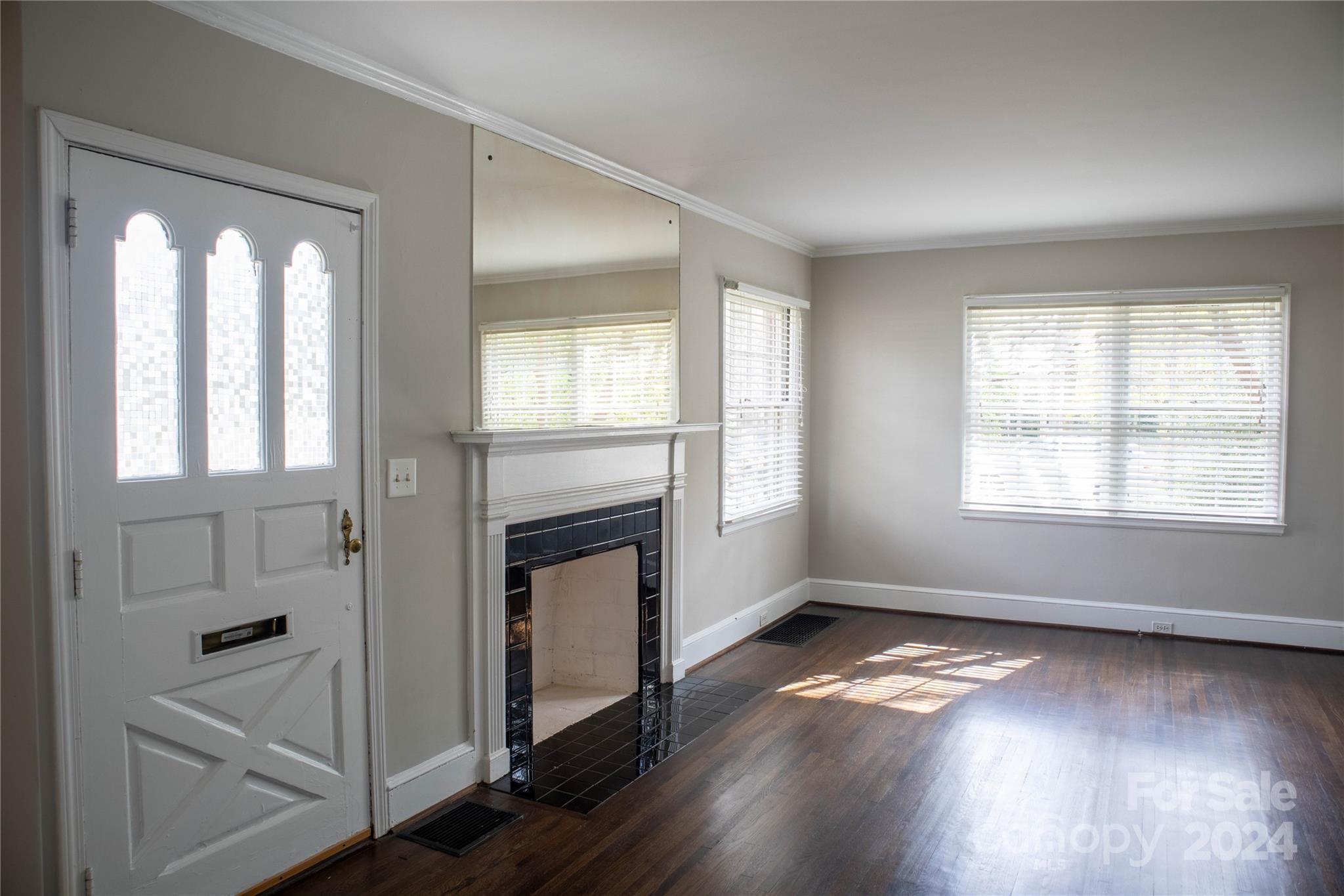 2932 Park Road Charlotte, NC 28209 - Photo 3 of 17 a view of empty room with wooden floor and fan