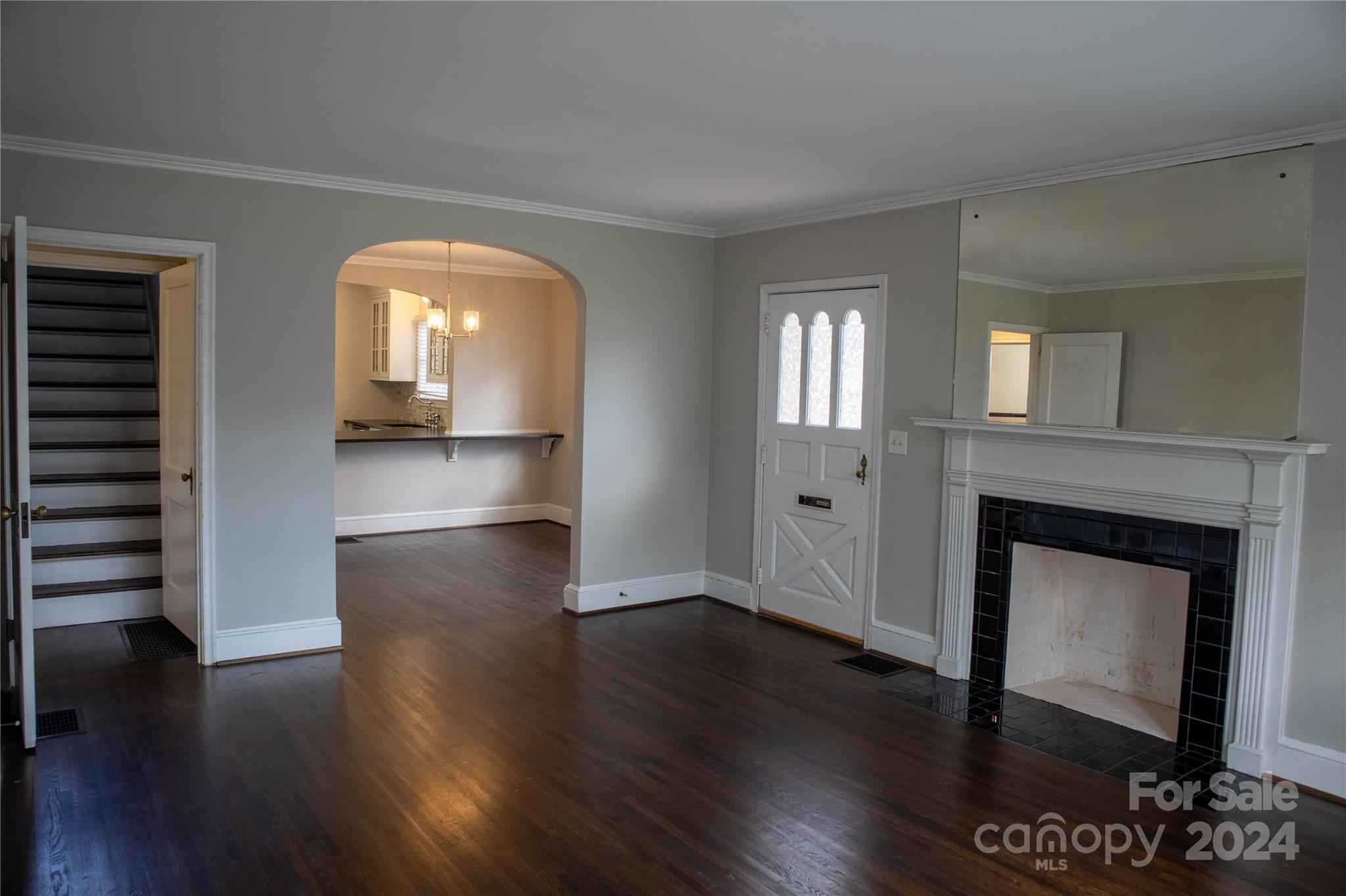 2932 Park Road Charlotte, NC 28209 - Photo 4 of 17 a view of a livingroom with wooden floor and a fireplace