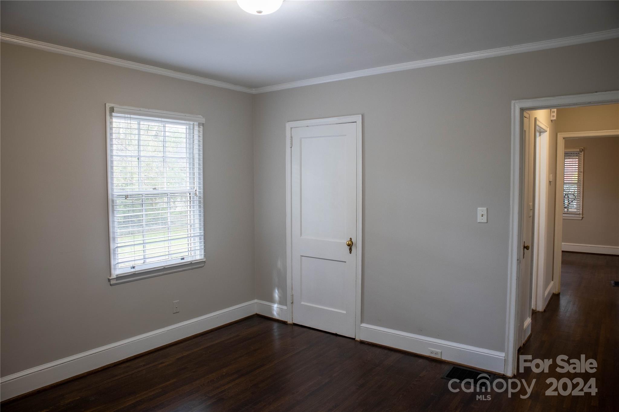 2932 Park Road Charlotte, NC 28209 - Photo 9 of 17 a view of an empty room with wooden floor and a window