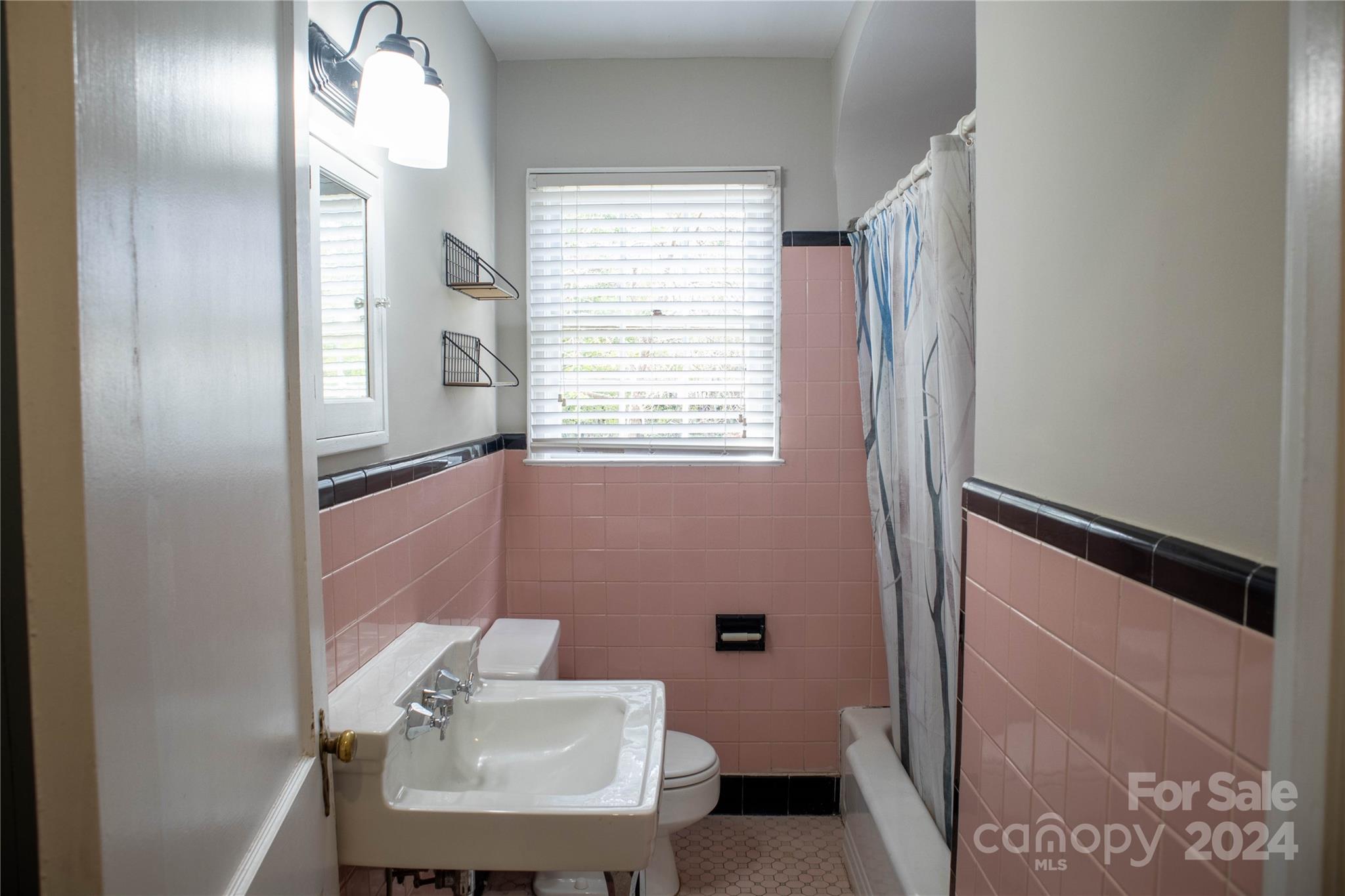 2932 Park Road Charlotte, NC 28209 - Photo 10 of 17 a bathroom with a sink toilet and mirror