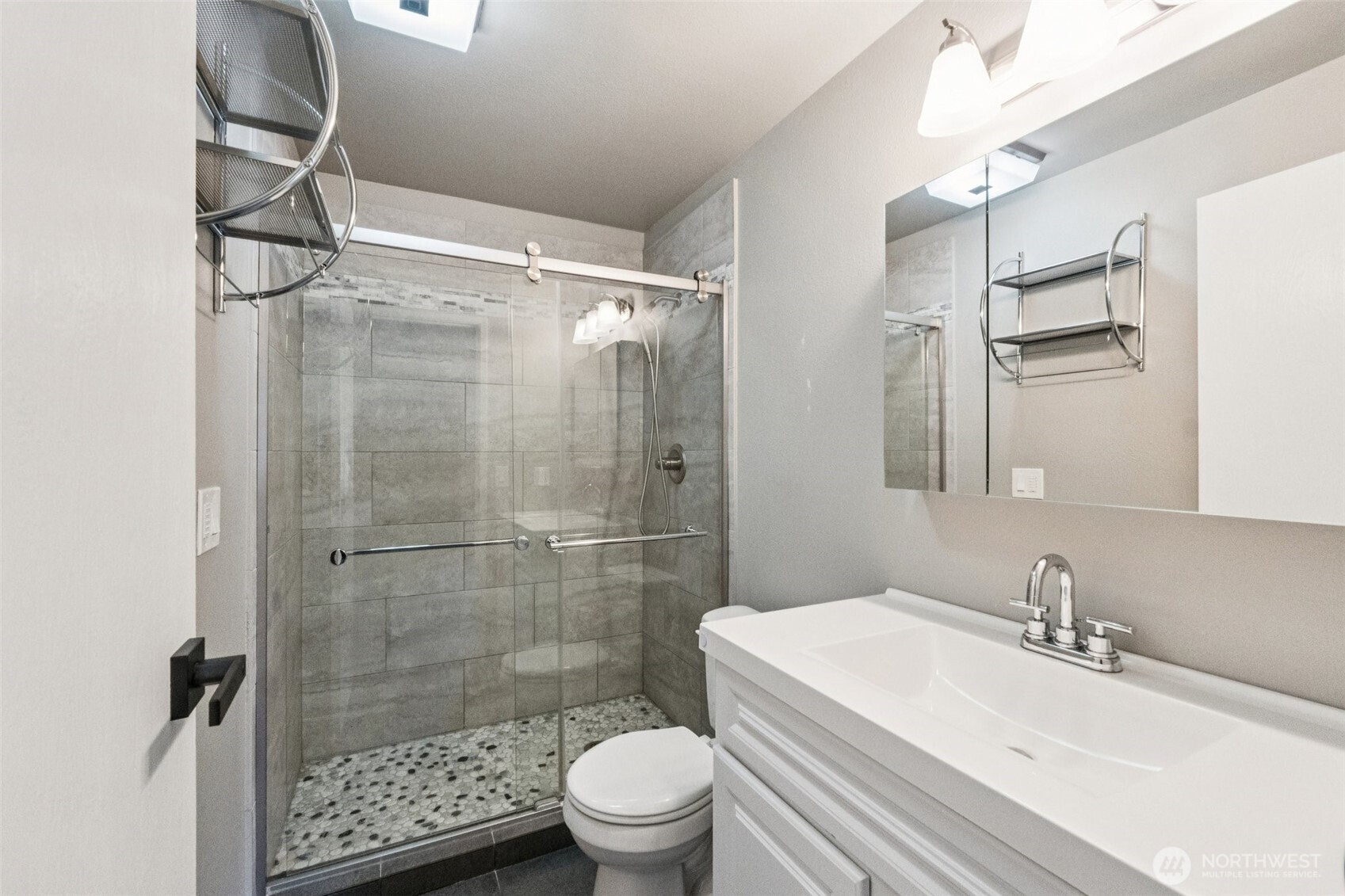5502 220th Street Southwest, Unit D201 Mountlake Terrace, WA 98043 - Photo 11 of 19 a bathroom with a sink toilet and shower