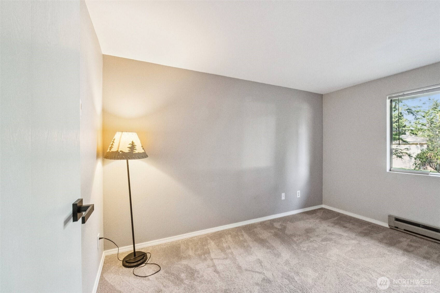5502 220th Street Southwest, Unit D201 Mountlake Terrace, WA 98043 - Photo 12 of 19 a view of a room with a window and a table