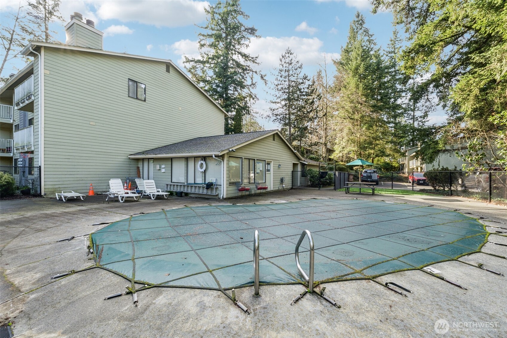 5502 220th Street Southwest, Unit D201 Mountlake Terrace, WA 98043 - Photo 17 of 19 a front view of a house with a yard