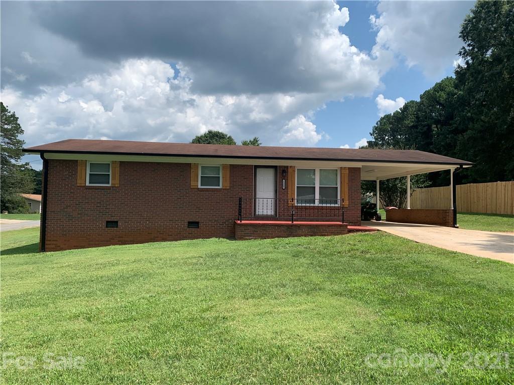 1900 Crestview Drive Newton, NC 28658 - Photo 1 of 13 a backyard of a house with table and chairs