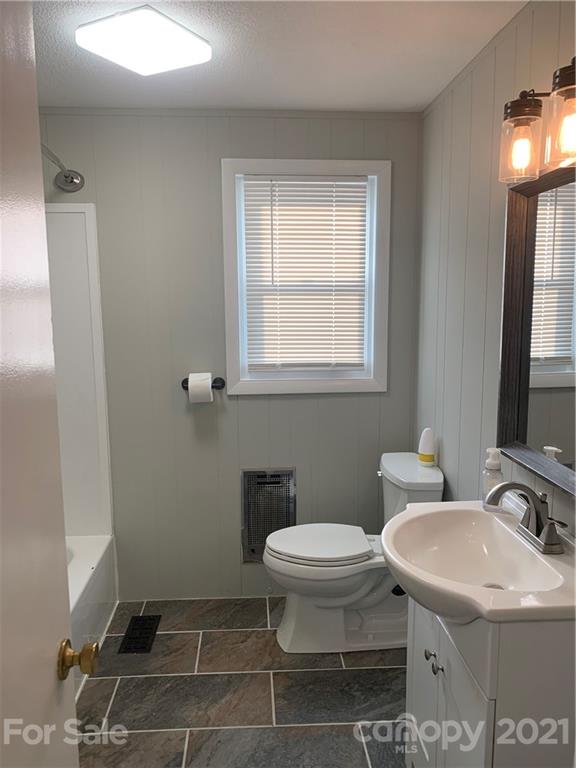 1900 Crestview Drive Newton, NC 28658 - Photo 4 of 13 a bathroom with a sink toilet and a mirror