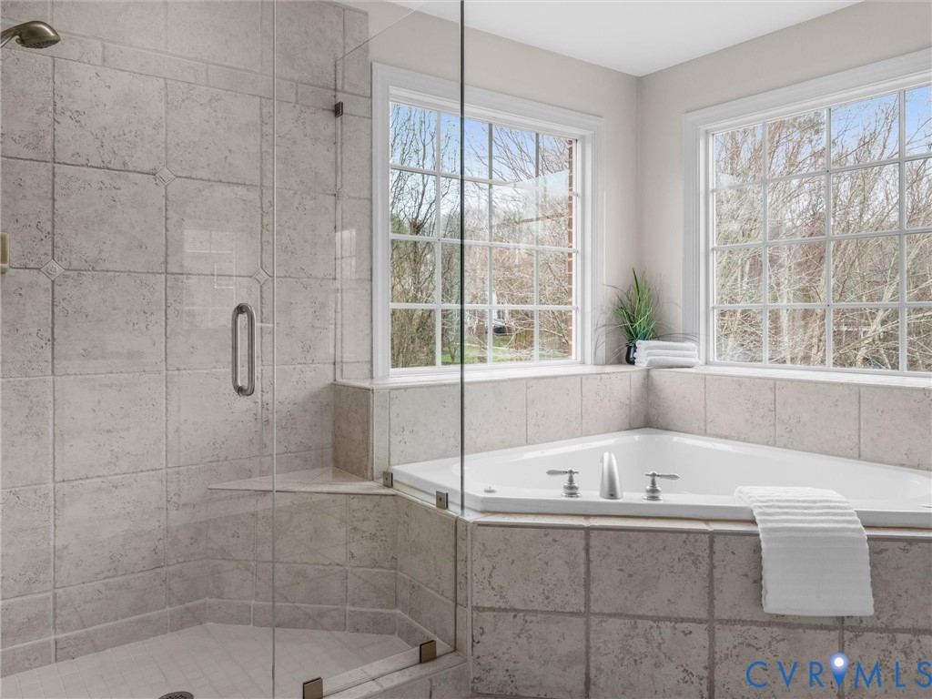 14335 Lander Road Midlothian, VA 23113 - Photo 42 of 70 a bathroom with a tub and shower