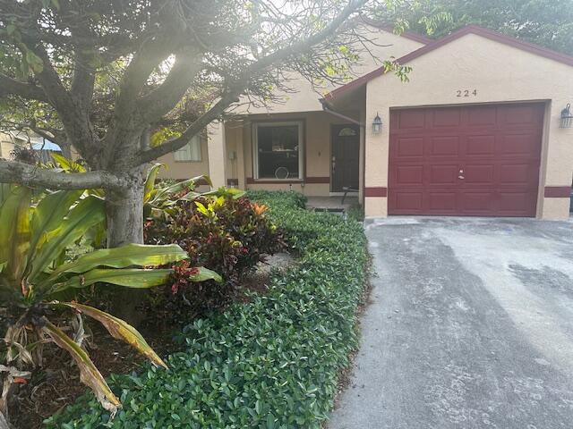 224 Southwest 9th Circle Delray Beach, FL 33444 - Photo 1 of 2 a view of a pathway with a house in front of it