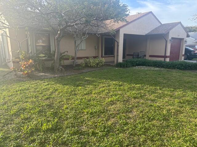 224 Southwest 9th Circle Delray Beach, FL 33444 - Photo 2 of 2 a view of a yard in front of house