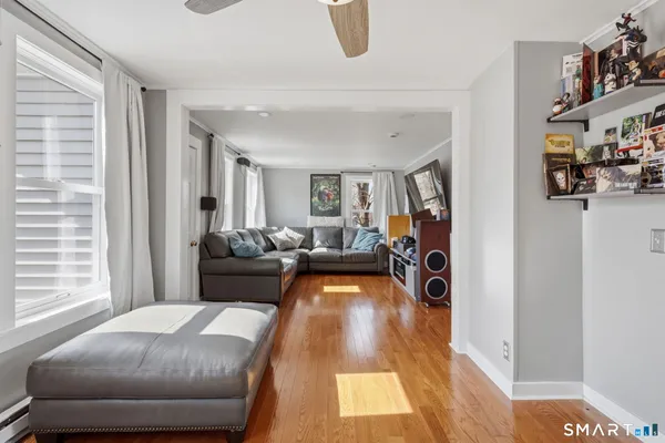 a living room with furniture and a window