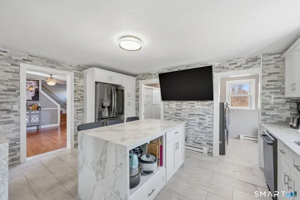 a kitchen with a sink stove and refrigerator