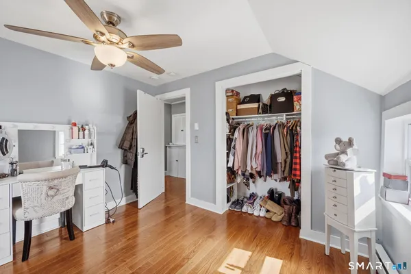 a view of a room with furniture window and wooden floor
