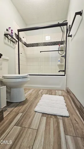 a view of a balcony with wooden floor