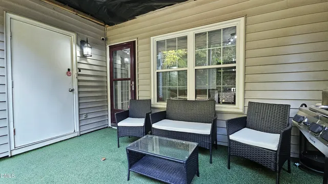 a outdoor living space with furniture and a potted plant