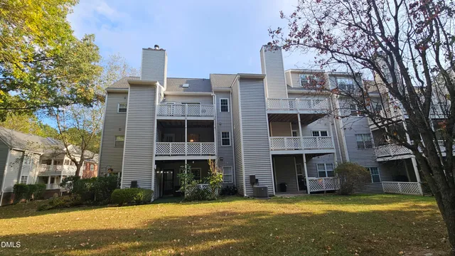 a view of a building with a yard