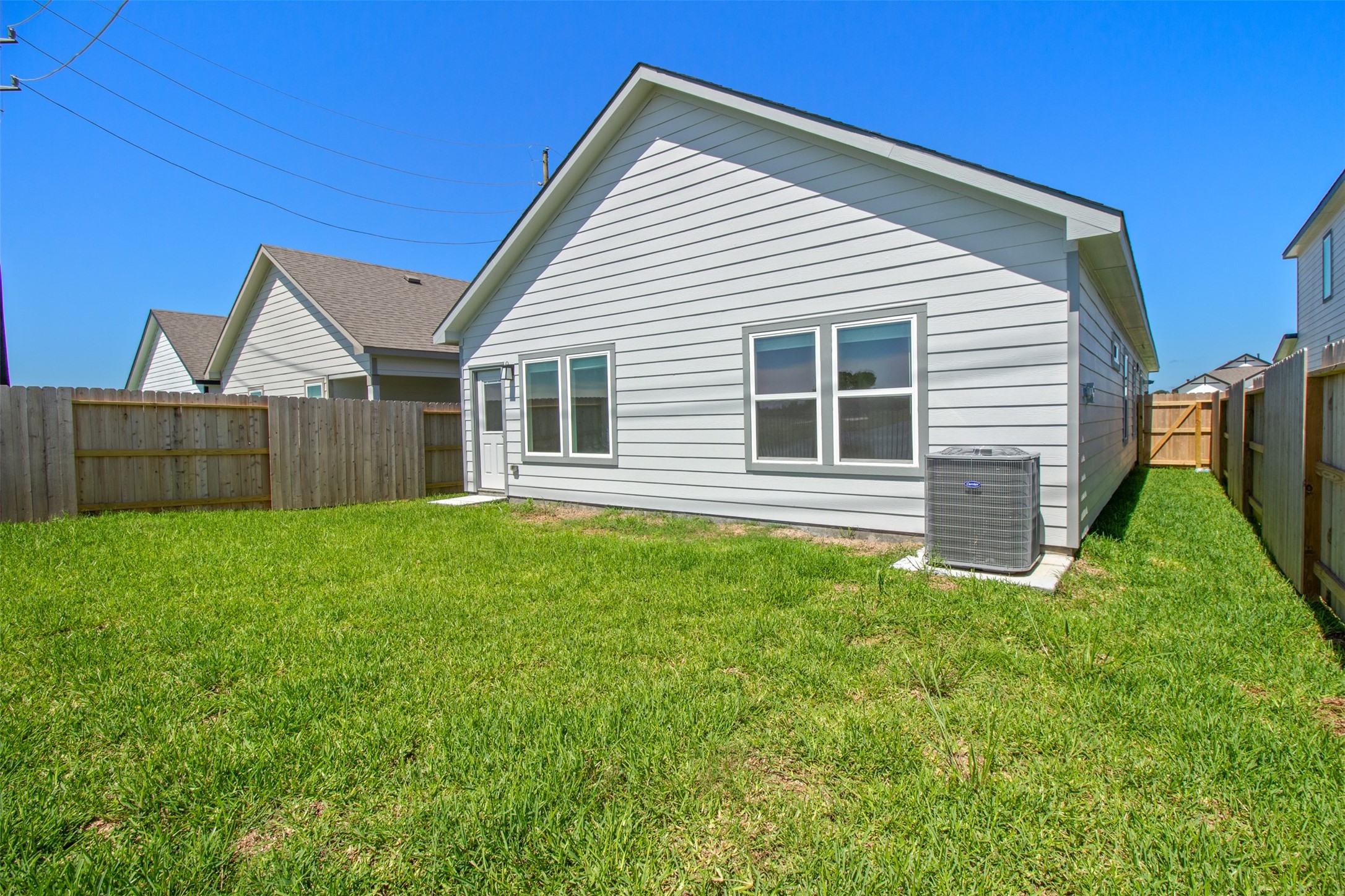 6643 Escondido Drive Rosharon, TX 77583 - Photo 21 of 25 a view of a house with a backyard