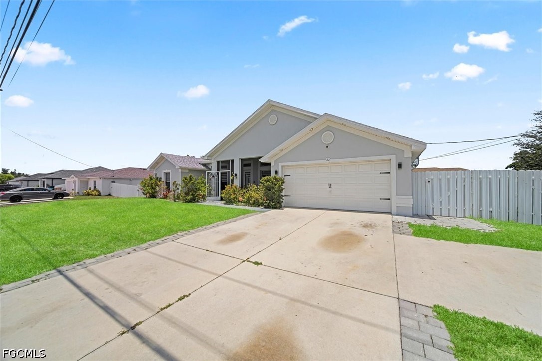 22 Nelson Road South Cape Coral, FL 33991 - Photo 2 of 43 a house view with a garden space