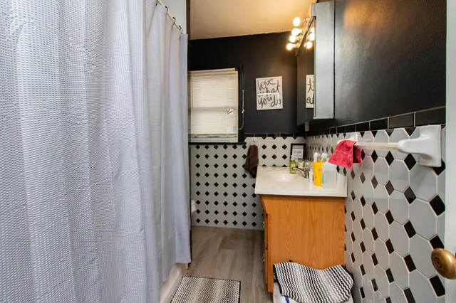 a bathroom with a sink and a mirror
