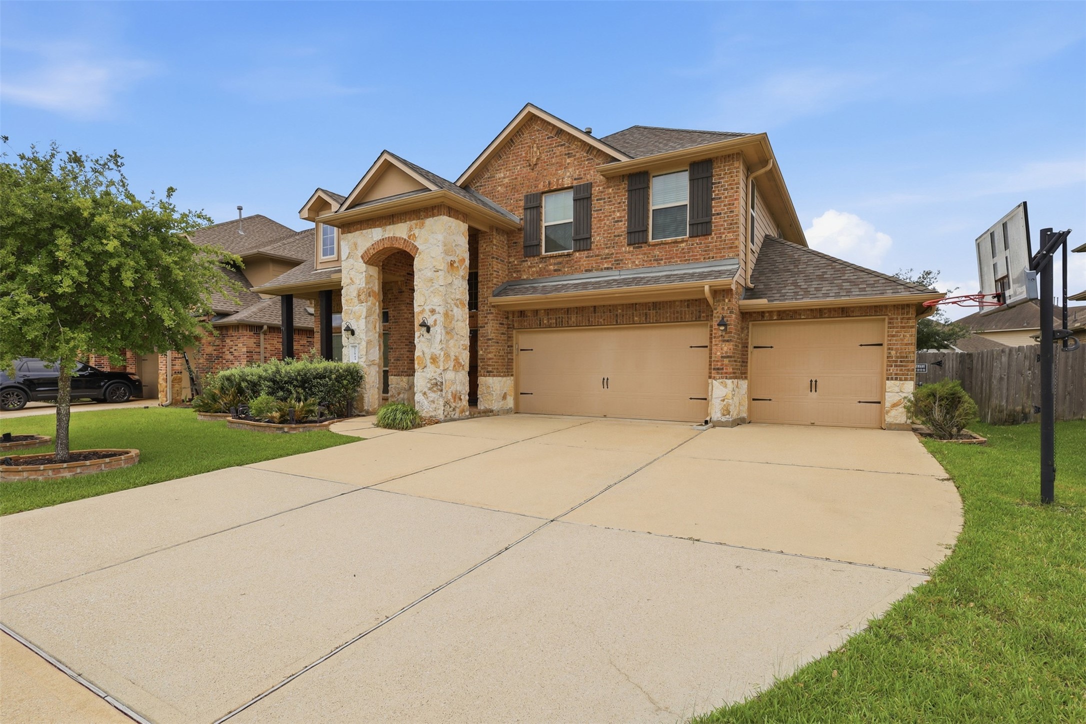 22943 Dale River Road Tomball, TX 77375 - Photo 2 of 29 a front view of a house with garden