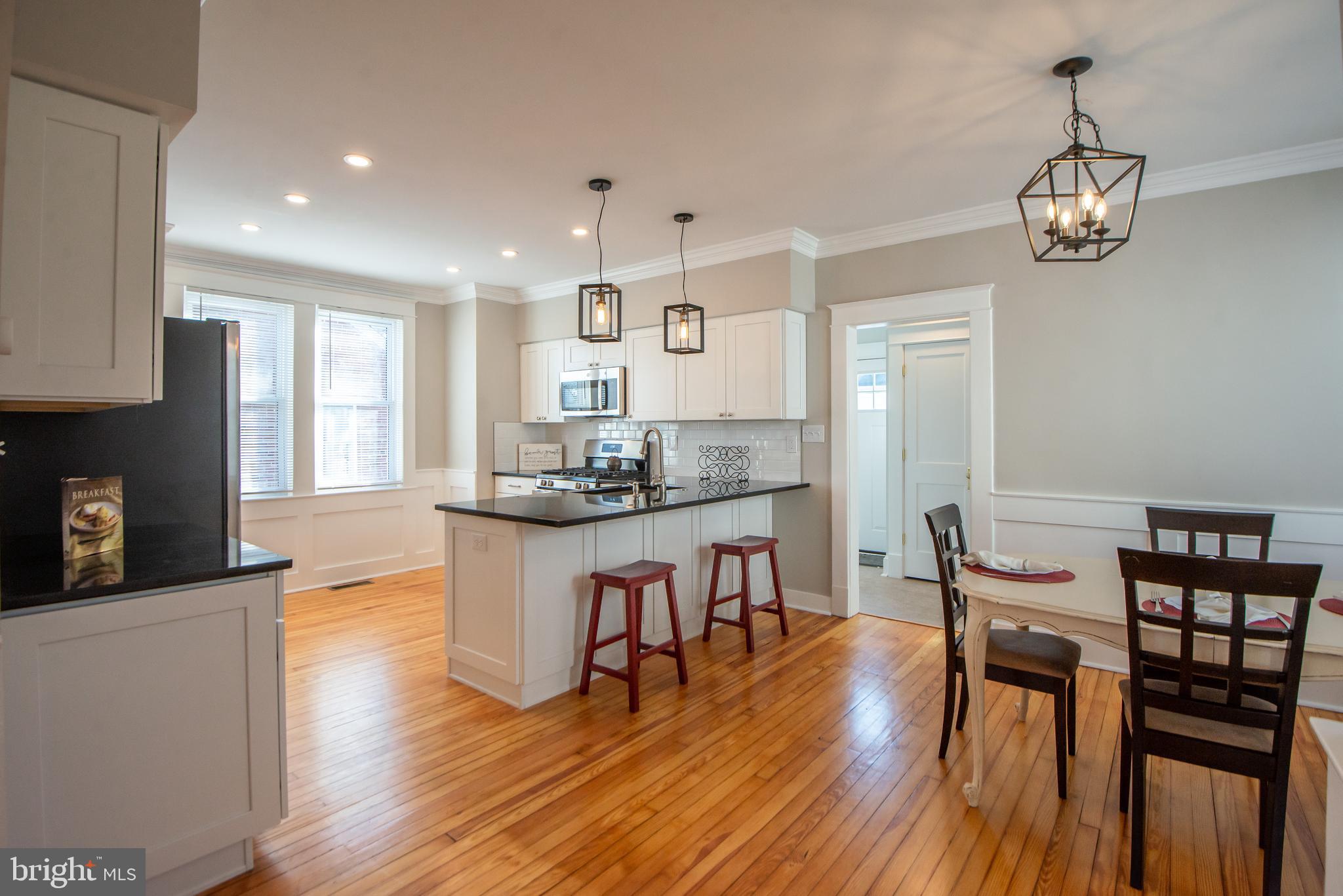 3323 Rueckert Avenue Baltimore, MD 21214 - Photo 5 of 27 kitchen with breakfast bar open to dining room