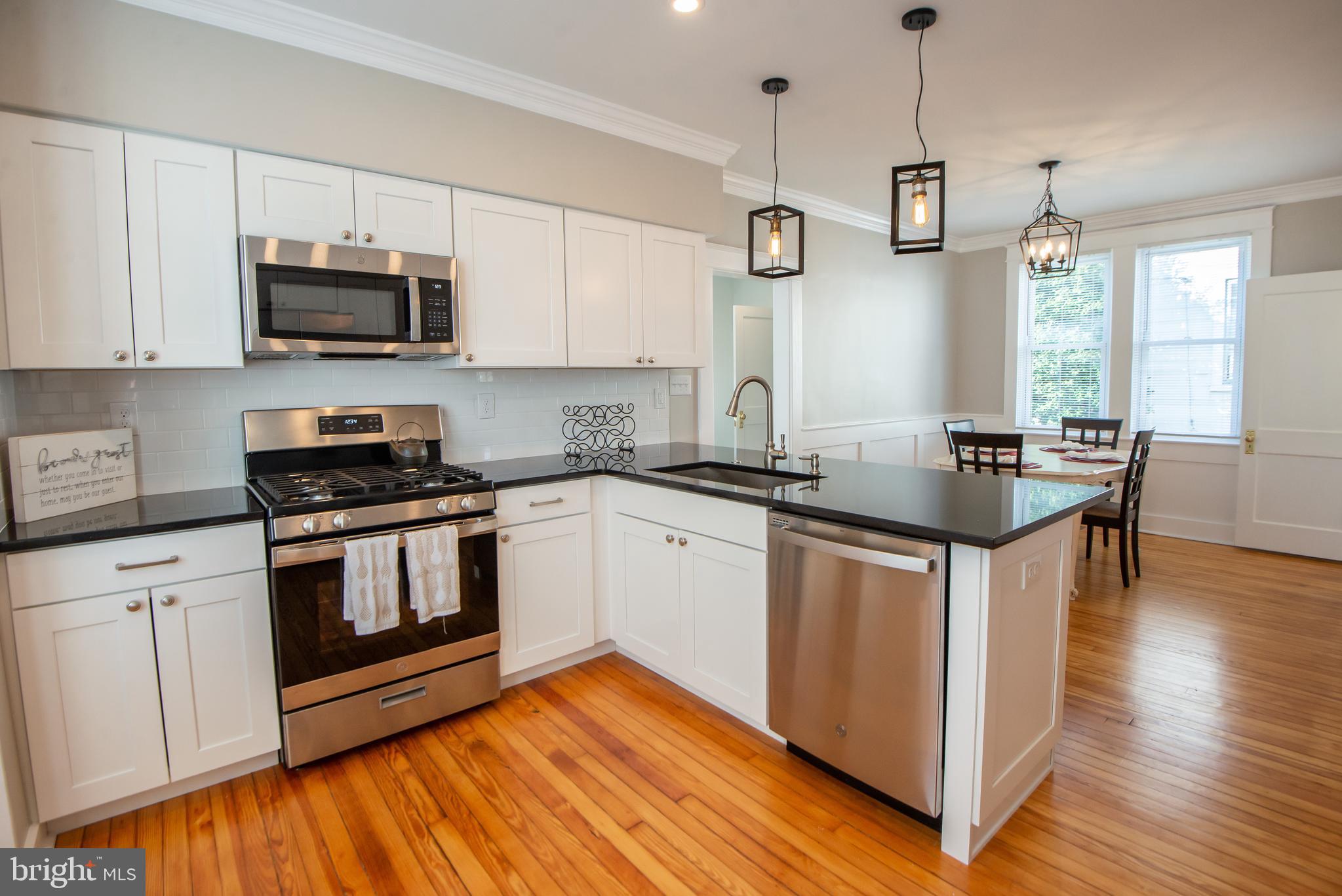 3323 Rueckert Avenue Baltimore, MD 21214 - Photo 7 of 27 new kitchen 2020 - hardwoods and breakfast bar