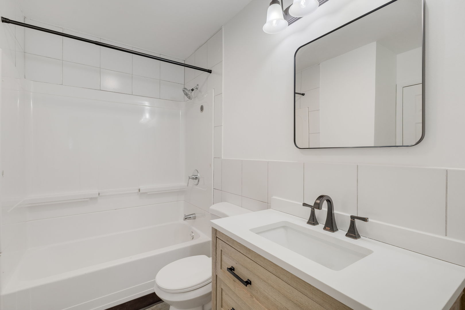 533 Redwood Road Bolingbrook, IL 60440 - Photo 13 of 18 a bathroom with a granite countertop sink a toilet and shower