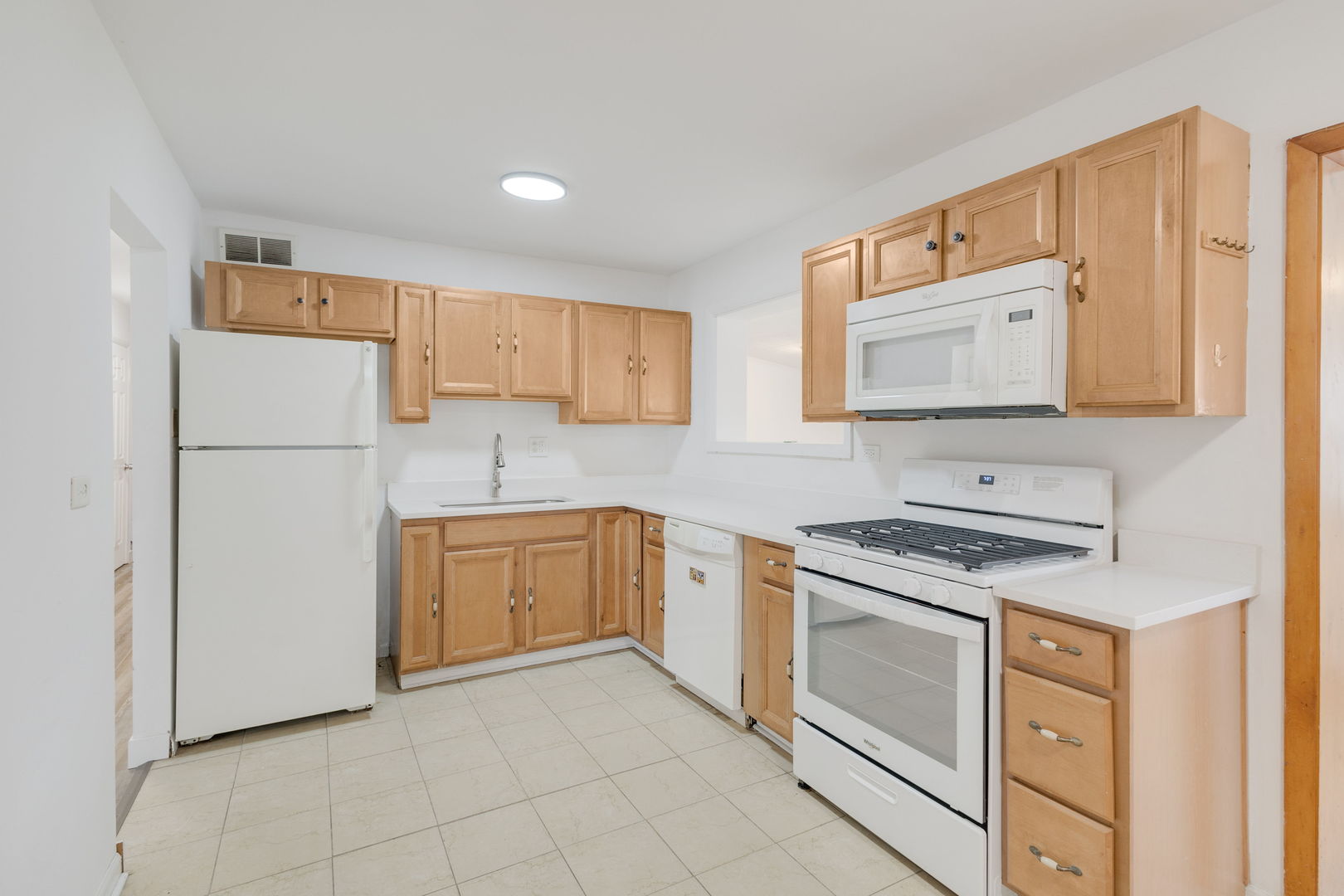 533 Redwood Road Bolingbrook, IL 60440 - Photo 5 of 18 a kitchen with stainless steel appliances granite countertop a refrigerator and a stove top oven
