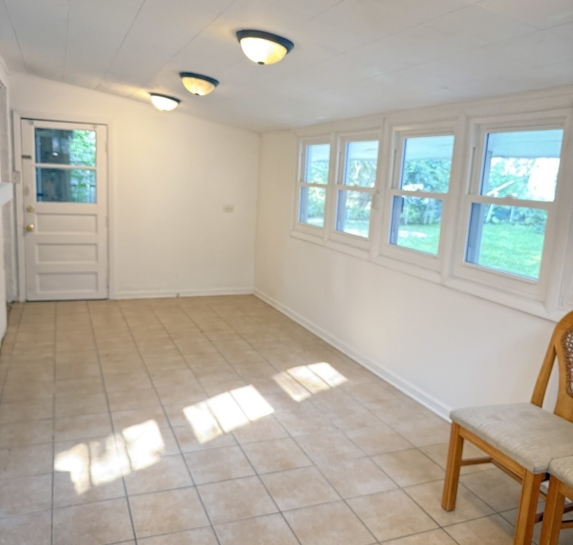 533 Redwood Road Bolingbrook, IL 60440 - Photo 8 of 18 a view of an empty room and window