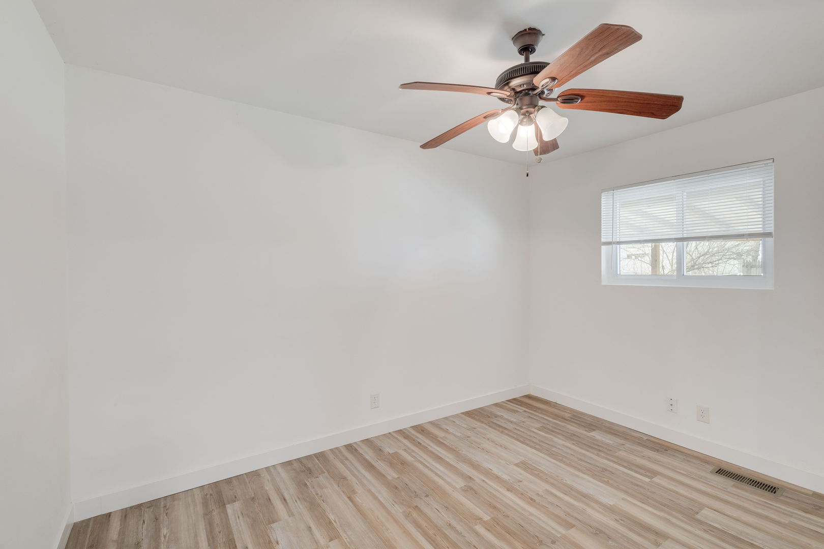 533 Redwood Road Bolingbrook, IL 60440 - Photo 9 of 18 wooden floor in an empty room with a window
