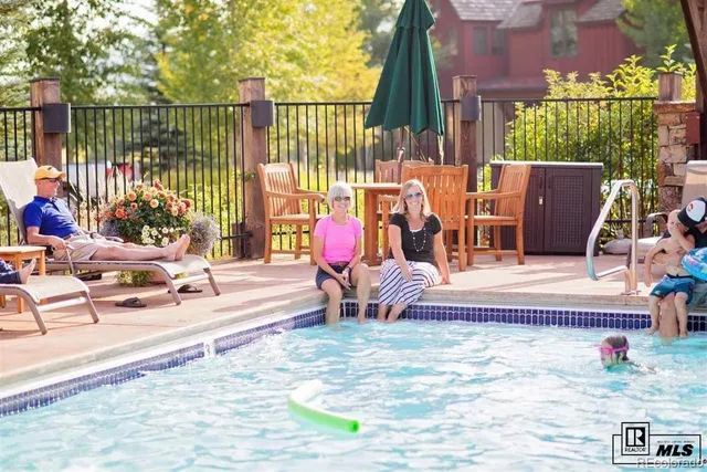 a view of a house with backyard porch and furniture