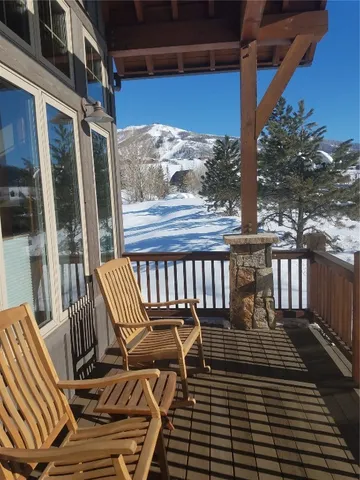 a view of balcony with wooden floor