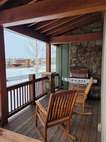 a balcony view with a seating space