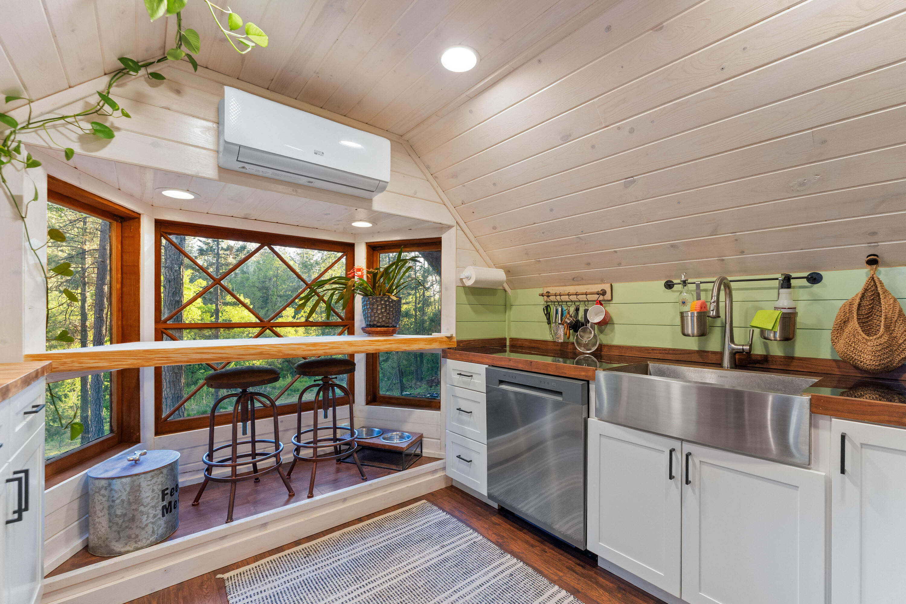 7704 Eastmoore Road Shingletown, CA 96088 - Photo 19 of 30 a kitchen with stainless steel appliances wooden floor and a large window