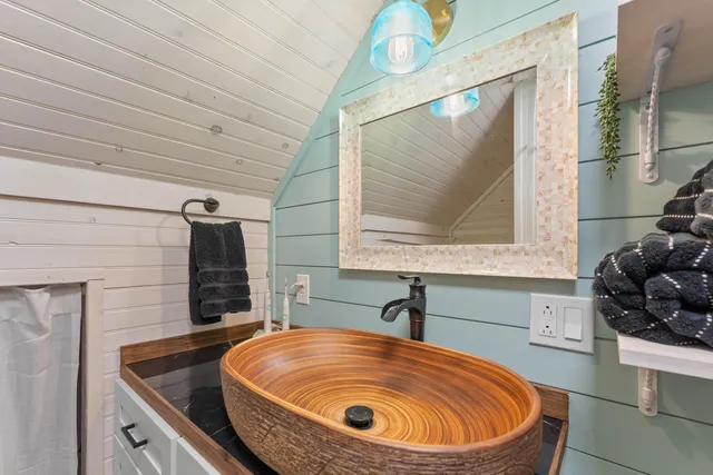 a view of a living room and bathroom