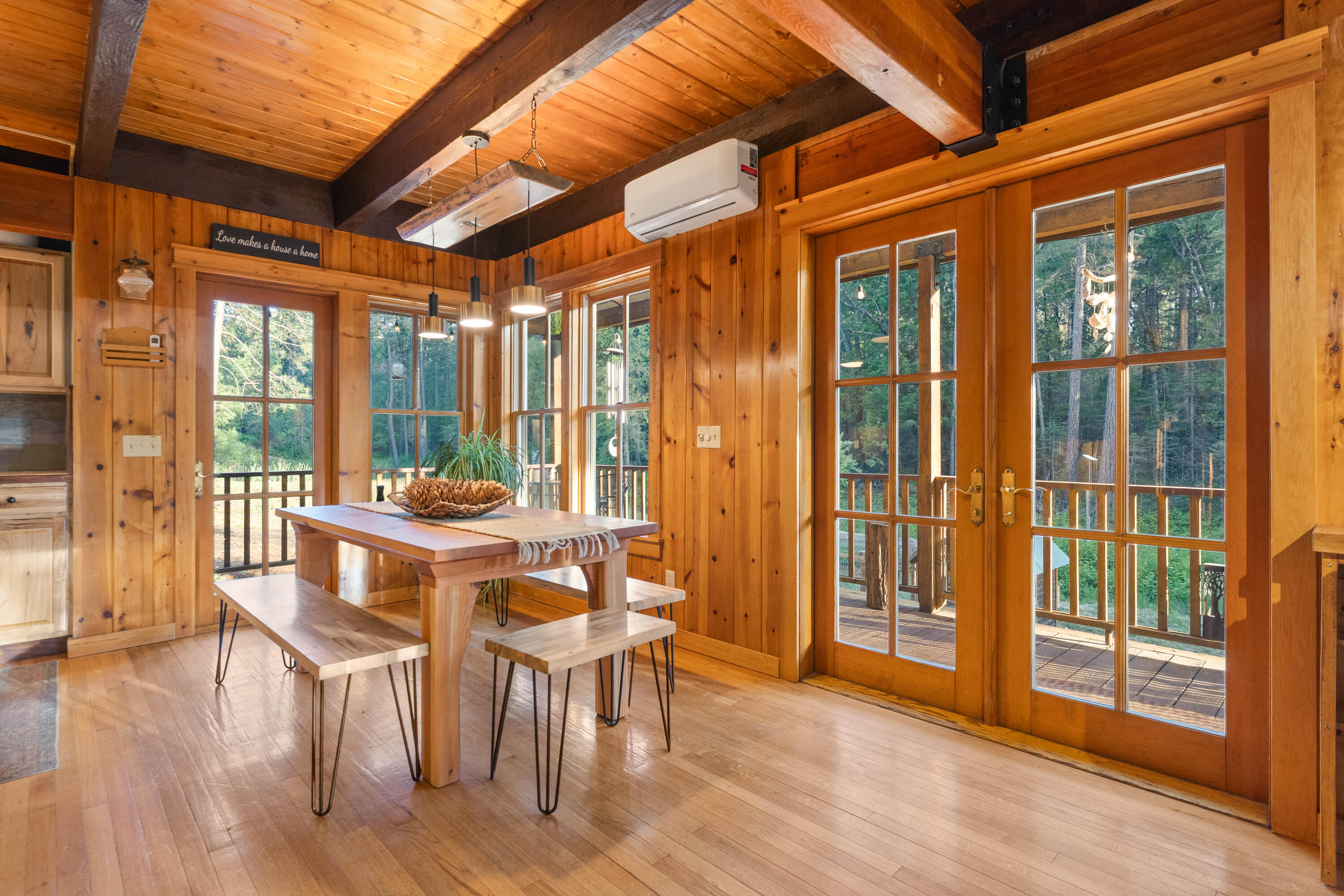 7704 Eastmoore Road Shingletown, CA 96088 - Photo 6 of 30 a view of a dining room with furniture window and wooden floor