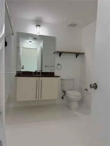 a bathroom with a toilet