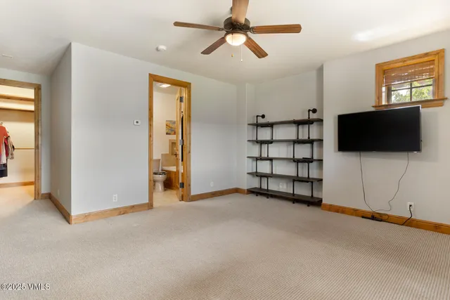 an aerial view of a house with an outdoor space