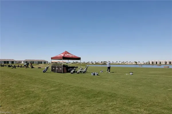 a view of a green field with clear sky
