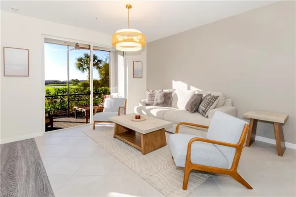 a living room with furniture and a table
