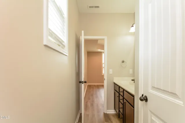 a view of a bathroom with a sink and mirror