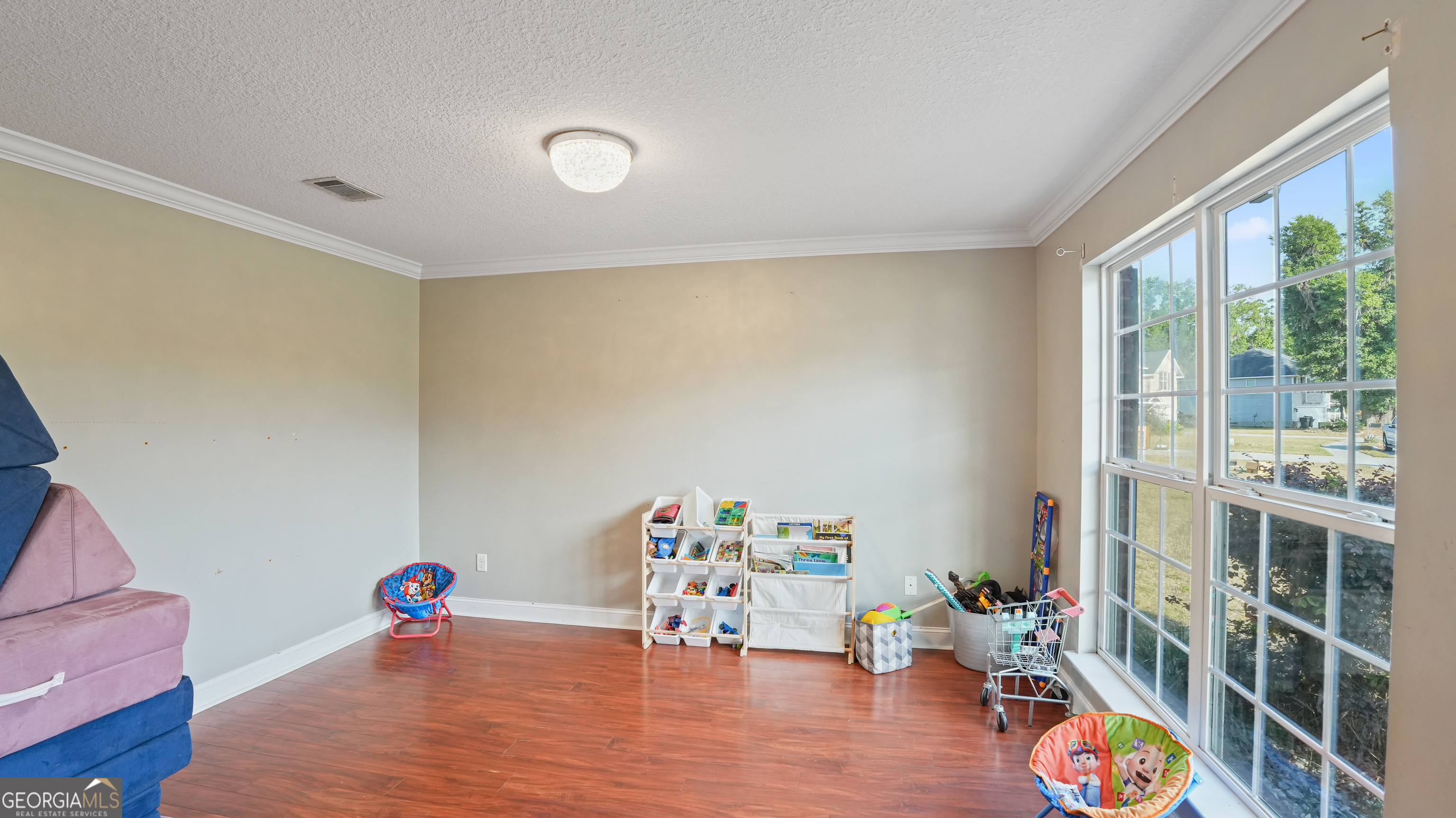 258 Nashview Trail Allenhurst, GA 31301 - Photo 11 of 40 a room with furniture and a wooden floor
