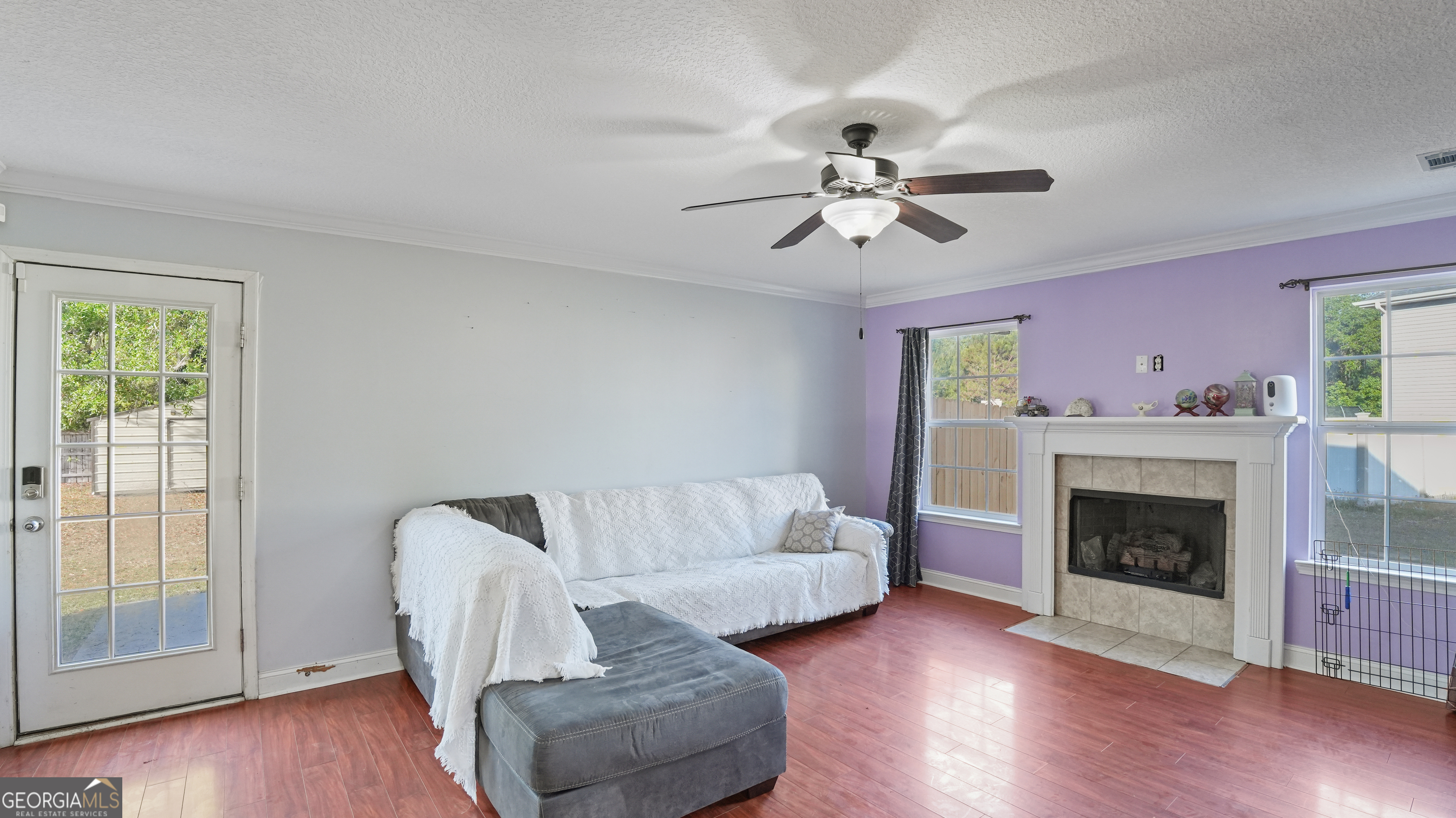 258 Nashview Trail Allenhurst, GA 31301 - Photo 13 of 40 a living room with furniture and a fireplace