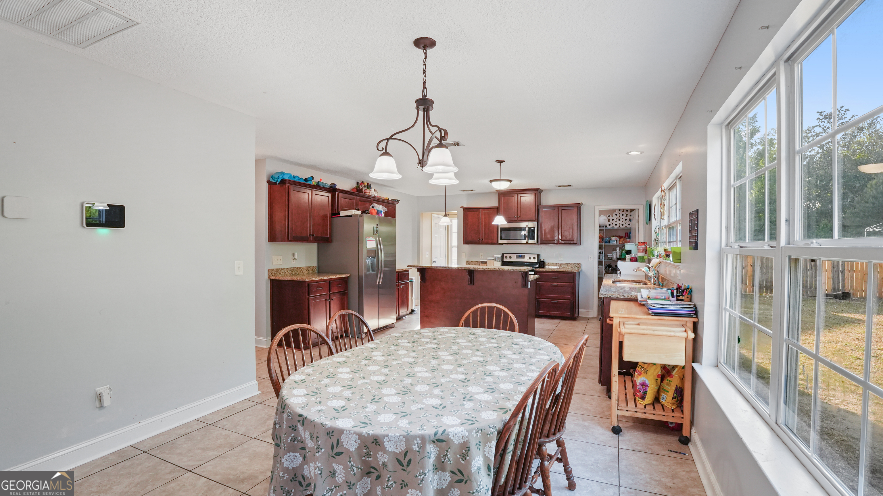 258 Nashview Trail Allenhurst, GA 31301 - Photo 15 of 40 a dining room with furniture and wooden floor