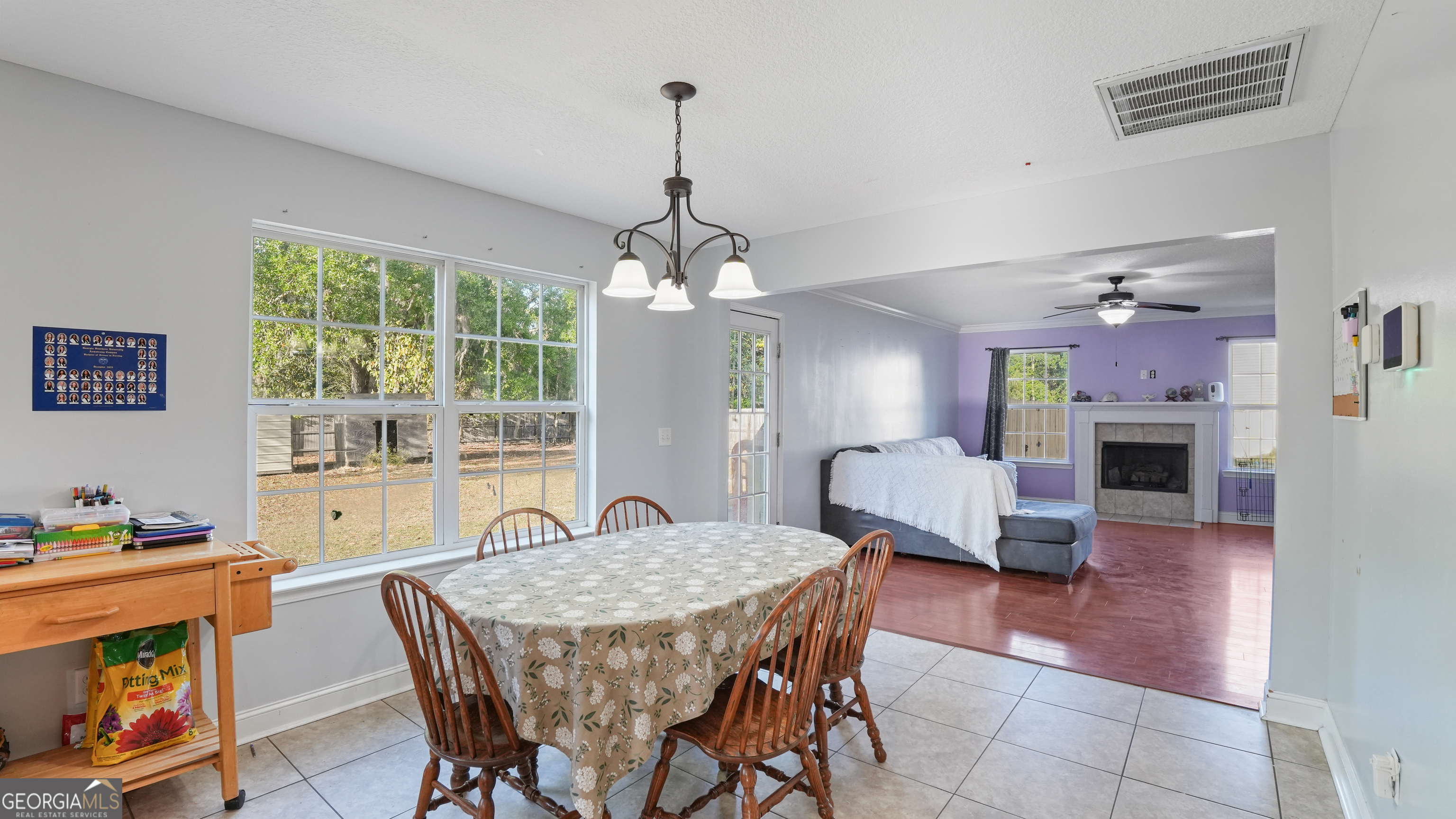 258 Nashview Trail Allenhurst, GA 31301 - Photo 16 of 40 a view of a dining room with furniture window and wooden floor