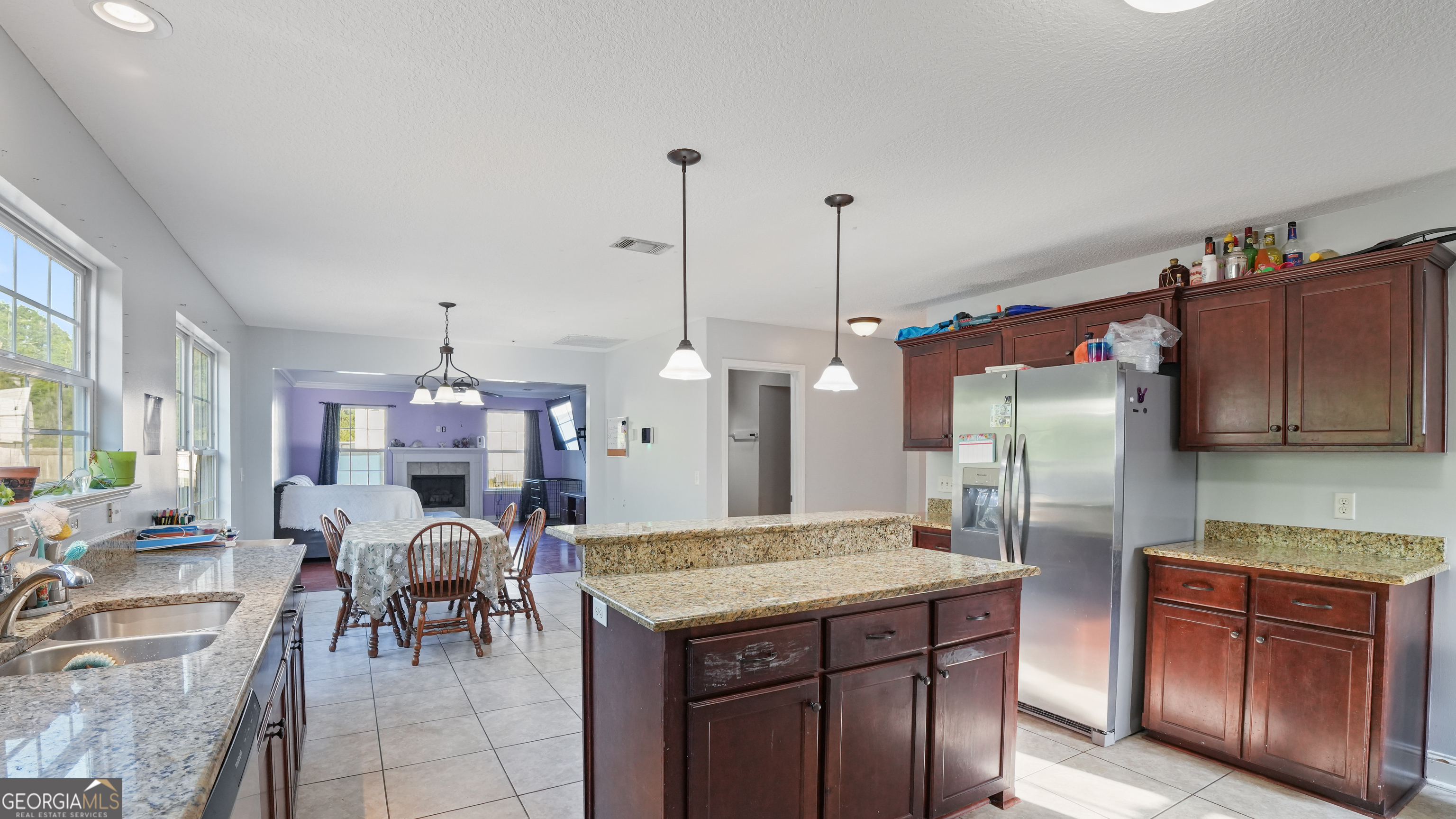 258 Nashview Trail Allenhurst, GA 31301 - Photo 18 of 40 a kitchen with cabinets and chairs