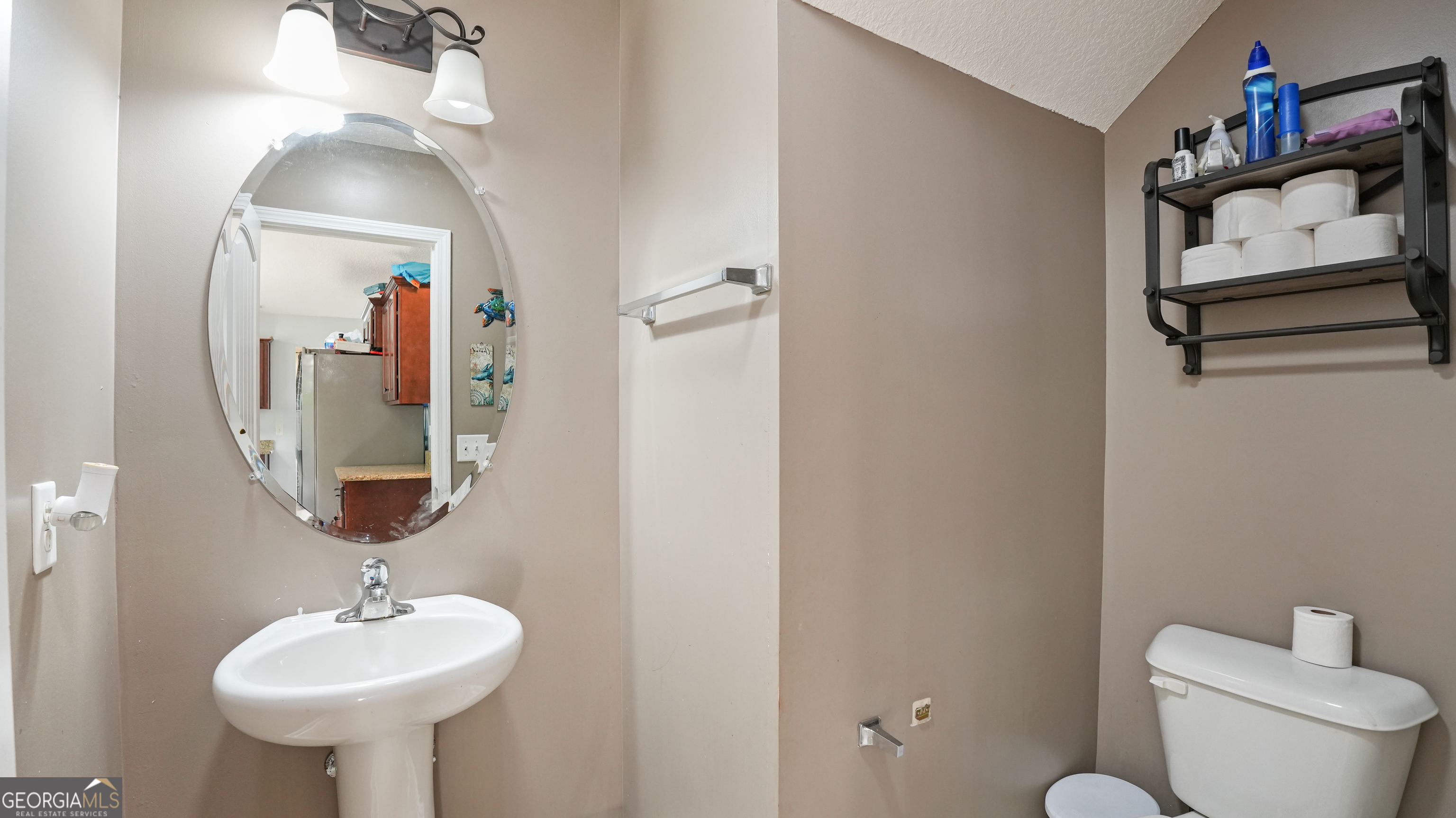 258 Nashview Trail Allenhurst, GA 31301 - Photo 21 of 40 a bathroom with a toilet sink and mirror