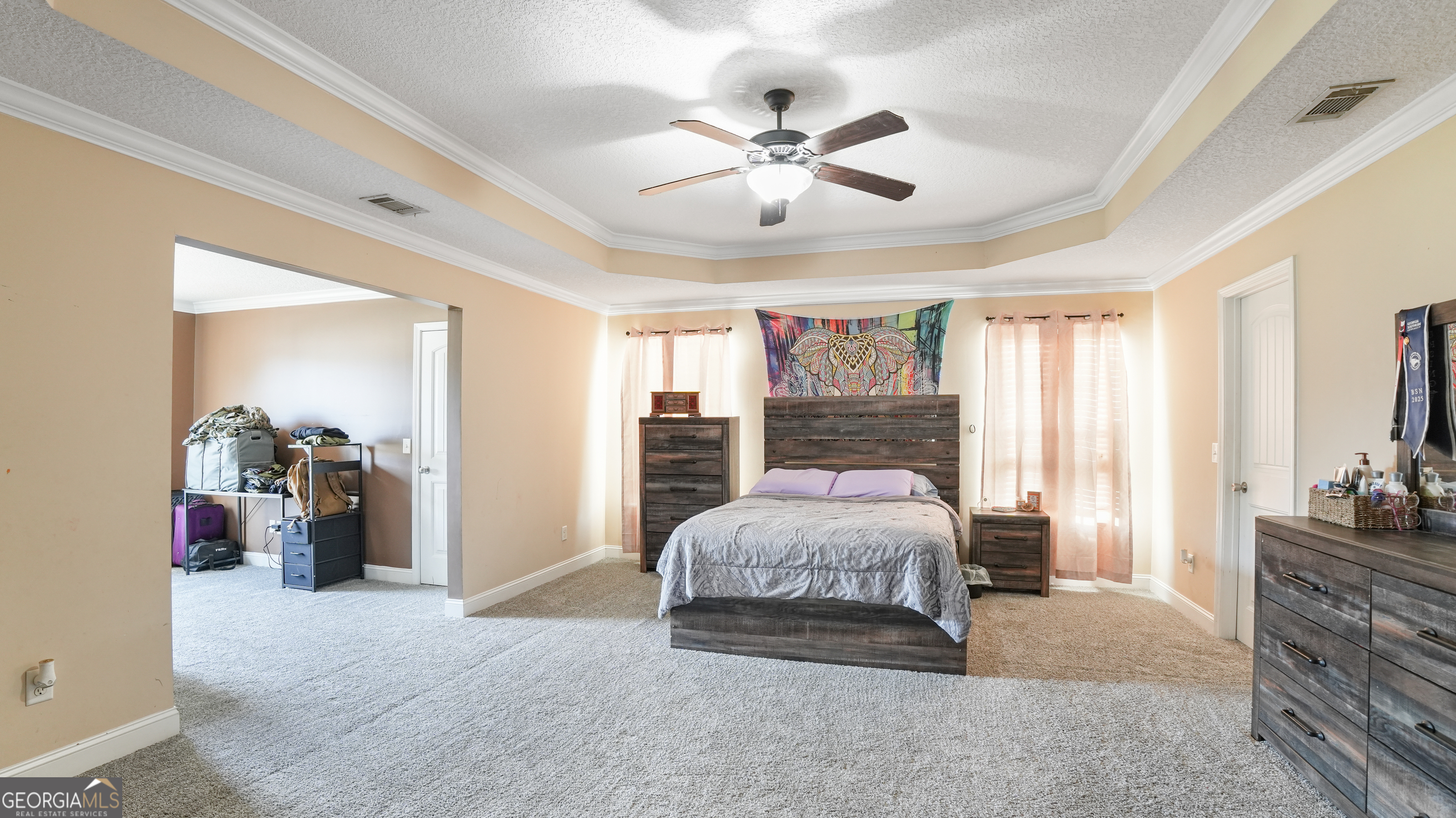 258 Nashview Trail Allenhurst, GA 31301 - Photo 24 of 40 a spacious bedroom with a bed and ceiling fan