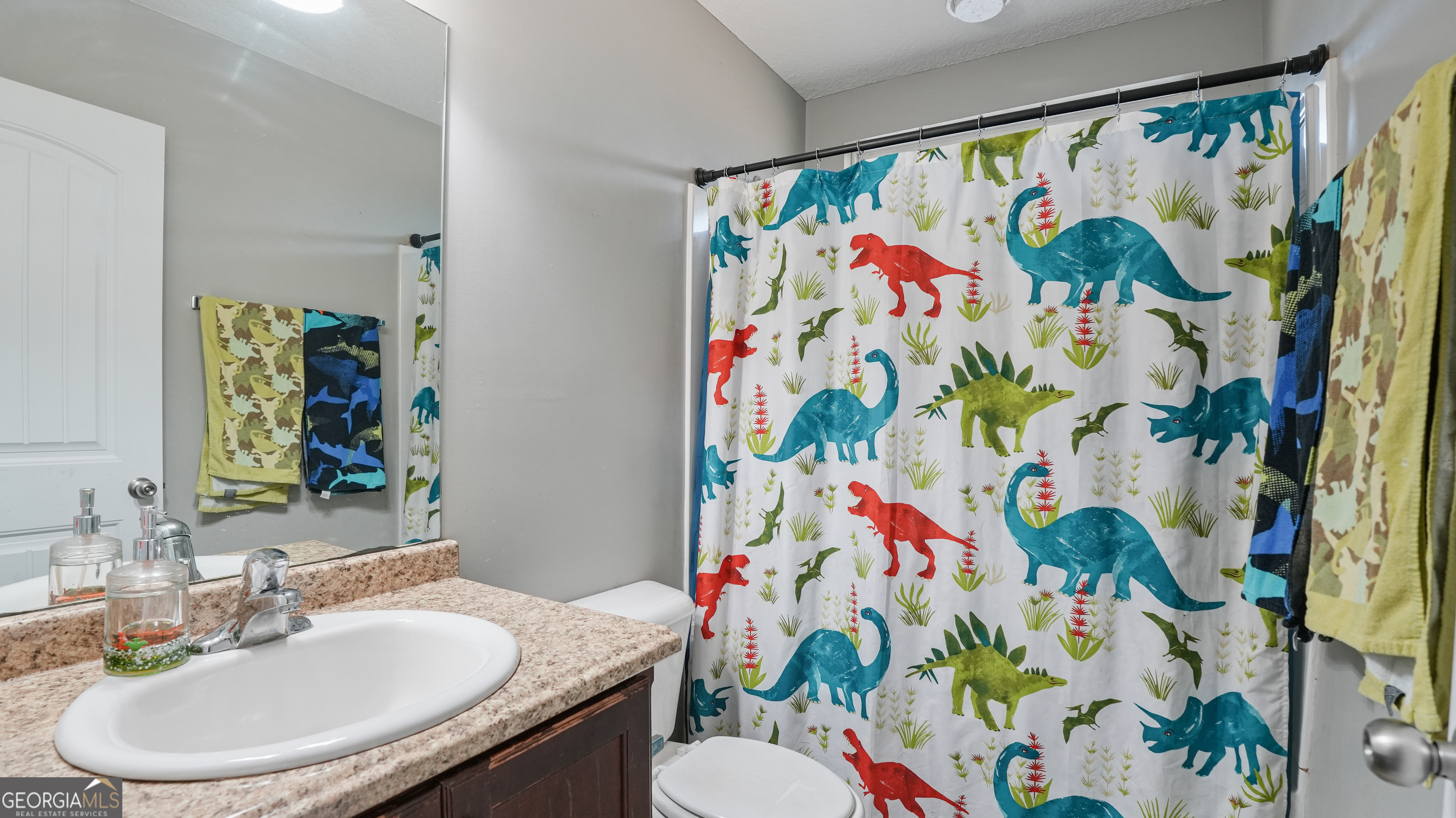 258 Nashview Trail Allenhurst, GA 31301 - Photo 34 of 40 a bathroom with a sink a mirror and painting on the wall