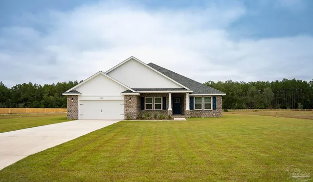 a view of a house with a big yard