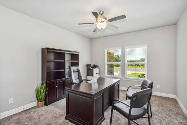 a work room with furniture and windows