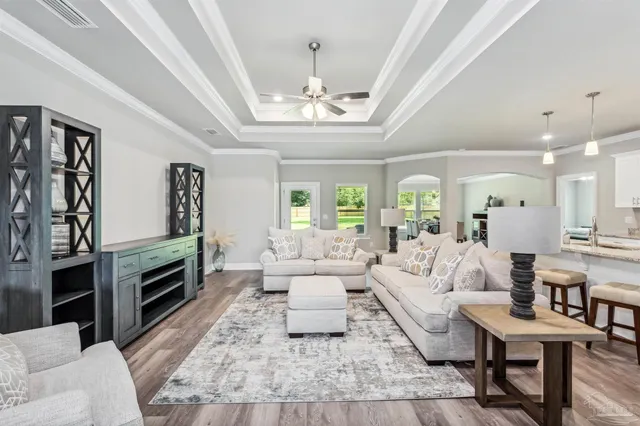 a living room with furniture fireplace and flat screen tv